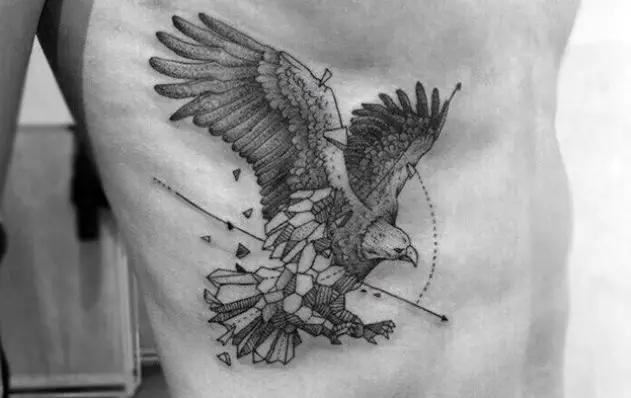 Geometric eagle tattoo on the side of the body