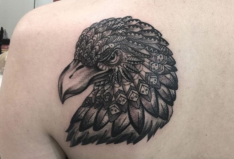 Tirbal head of an Eagle tattoo on the shoulder back