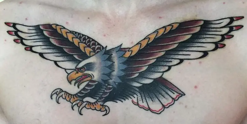 yellow, white, and red colored soaring eagle tattoo on chest.
