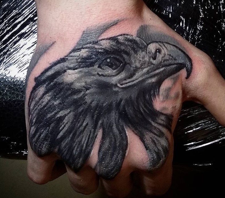 3D black and gray head of an Eagle Tattoo on the hand