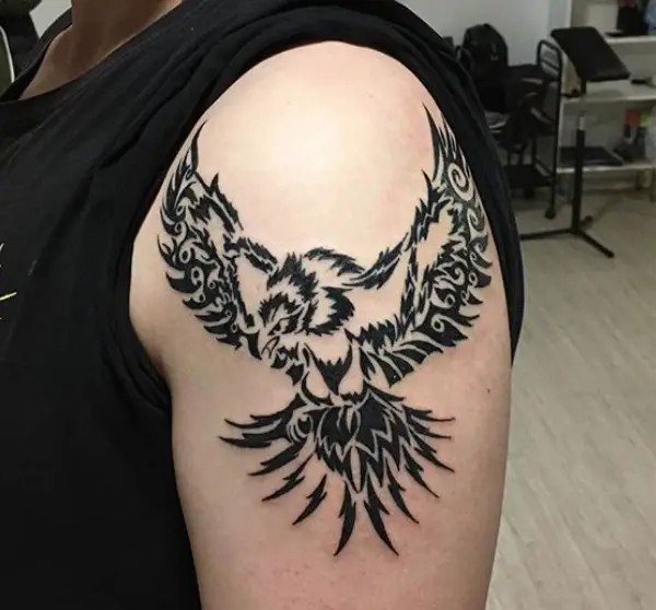 Tribal flying eagle tattoo on the shoulder