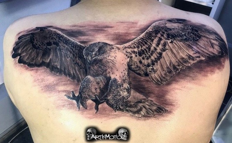 realistic black and gray landing Eagle Tattoo on the back