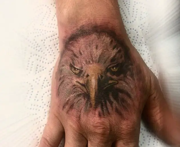 front view head of a realistic Eagle Tattoo on the hand