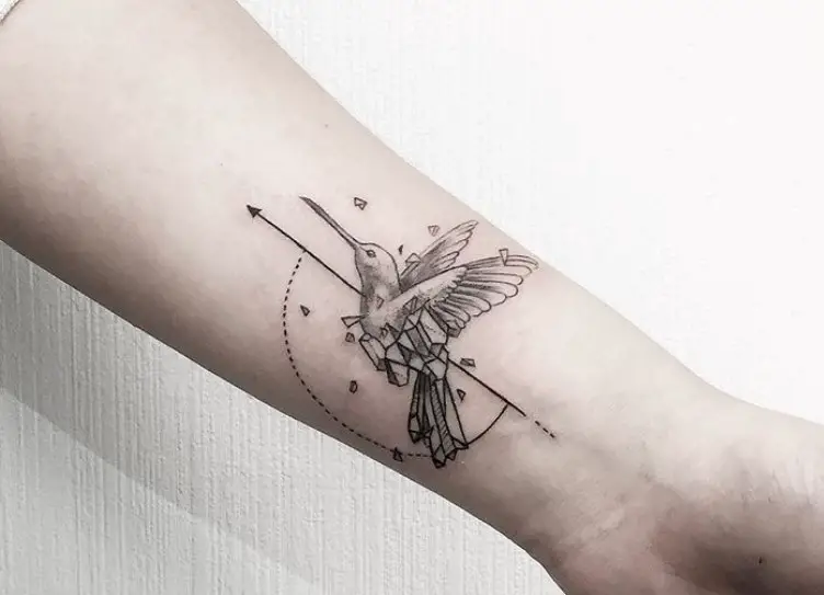 geometric flying hummingbird tattoo on wrist