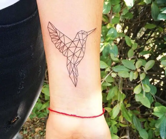 geometric hummingbird tattoo on inner wrist