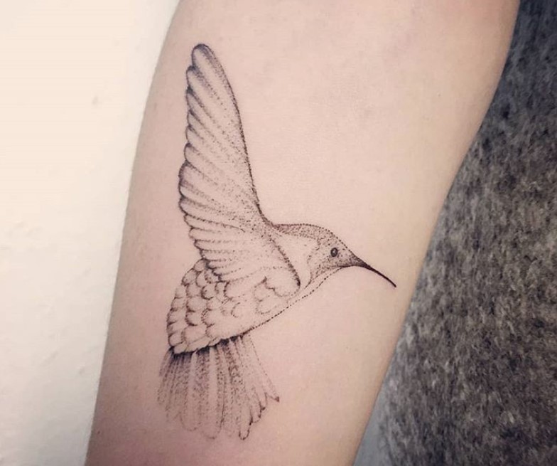 simple flying hummingbird tattoo on arms