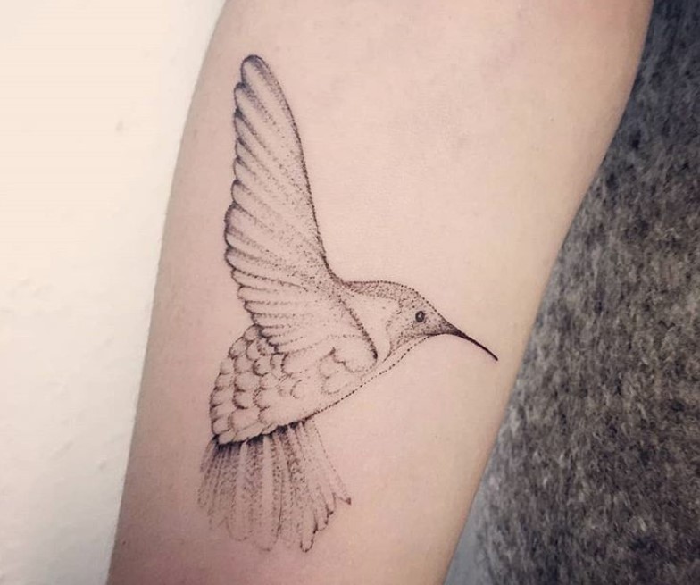 simple flying hummingbird tattoo on arms 