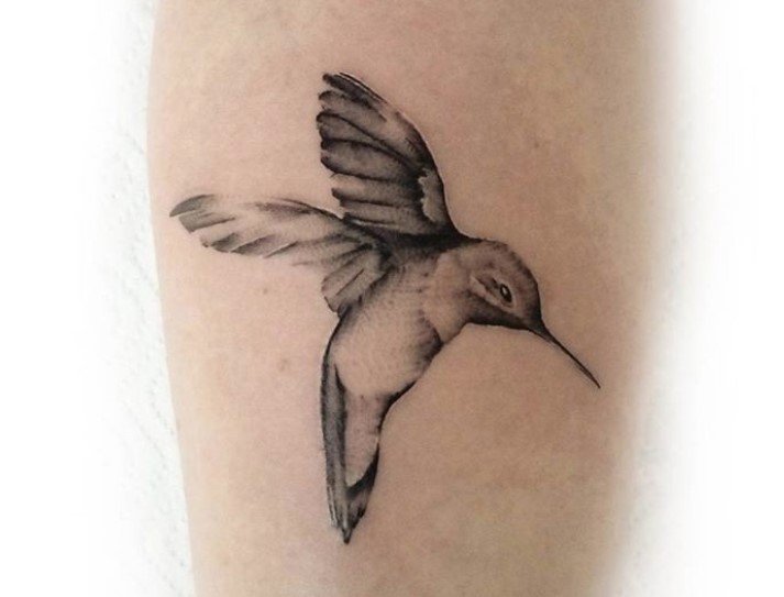 simple flying hummingbird tattoo