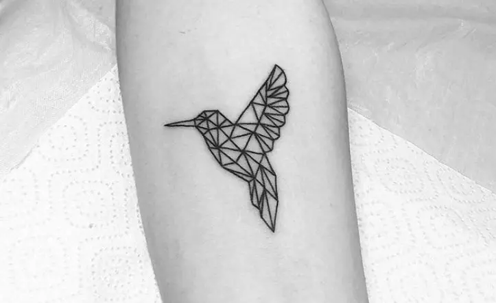 geometric hummingbird tattoo on forearm