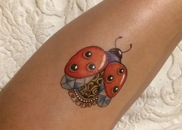 Stylish Ladybug Tattoo on the leg