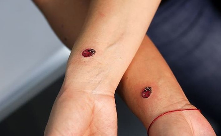 small Ladybug Tattoo on both wrist