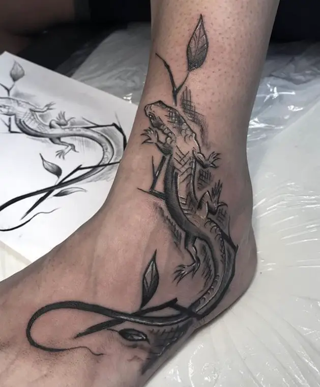 Lizard with scratches crawling in a plant Tattoo on foot