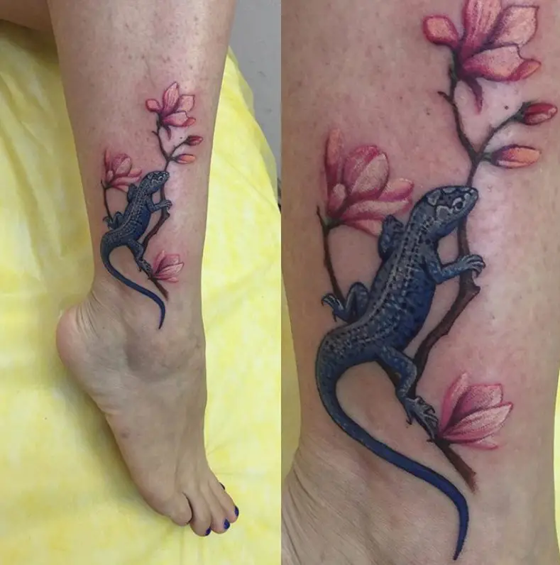 gray Lizard climbing on the branch of sakura tattoo on the leg
