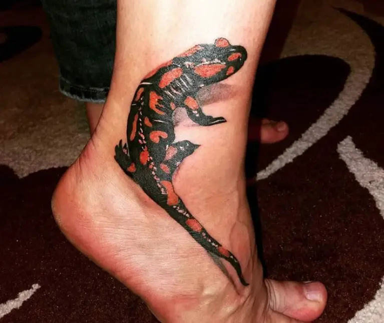 3D Lizard with orange and black pattern tattoo on the ankle