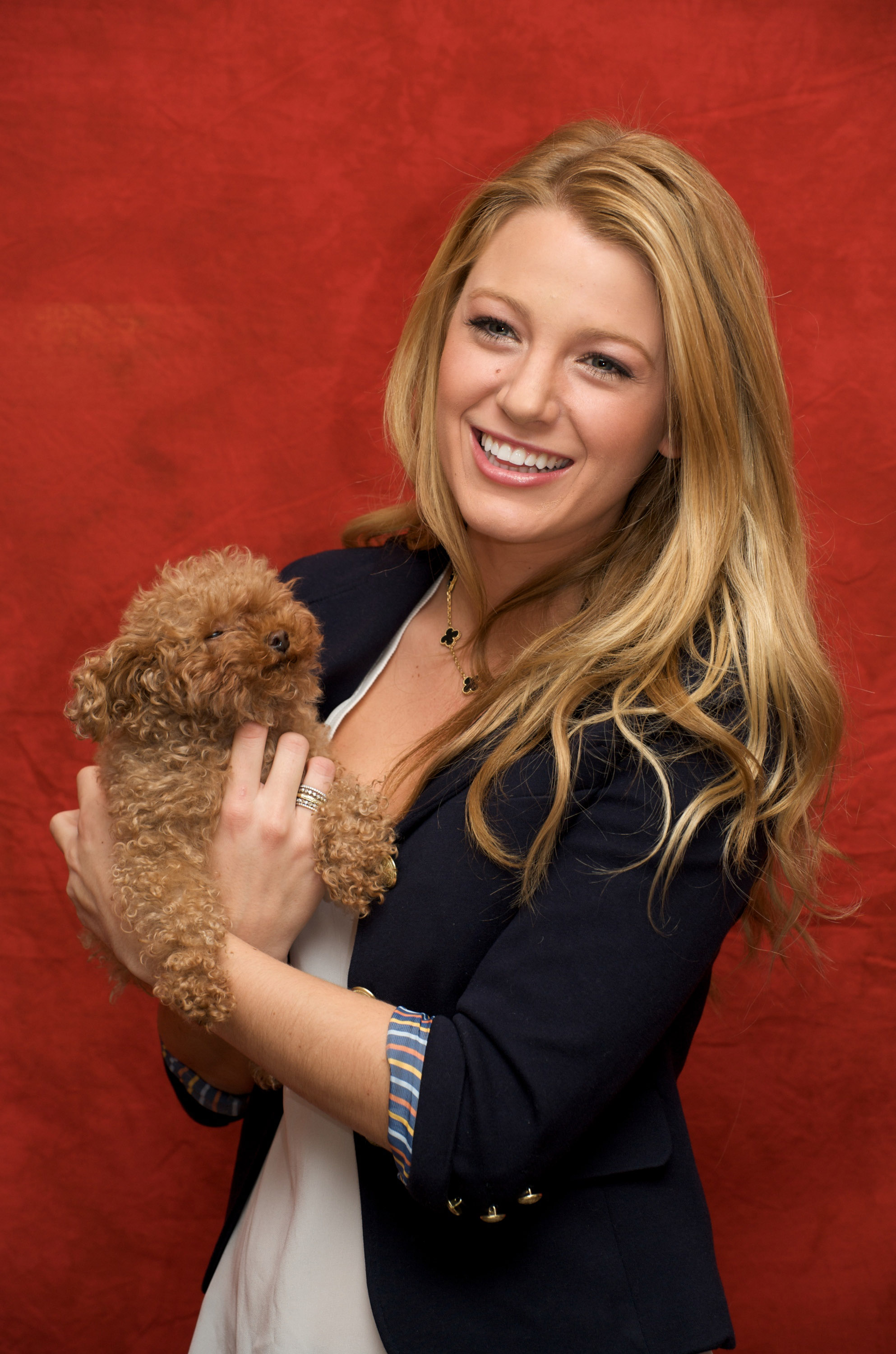 Blake Lively carrying her brown poodle puppy