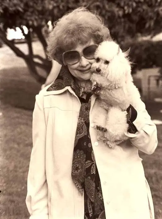 Lucille Ball holding her poodle puppy
