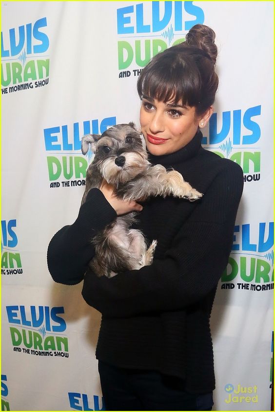 Lea Michele hugging her Schnauzer puppy