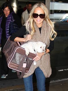 Kristin Chenoweth carrying her Shih Tzu in a bag