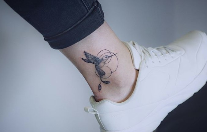 Small Hummingbird in circles tattoo on the ankle