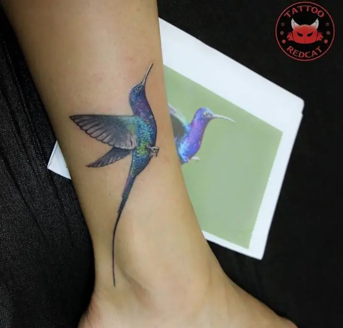 vibrant purple and blue Small Hummingbird Tattoo on the leg