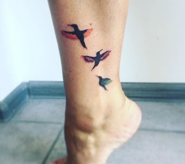 three colorful Small Hummingbird Tattoo on the leg