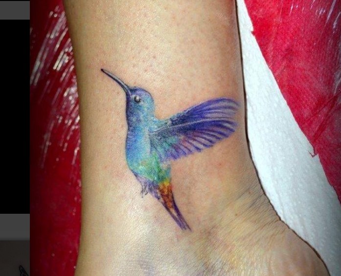 colorful Small Hummingbird Tattoo on the ankle