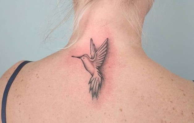 outline of Small Hummingbird Tattoo on the back