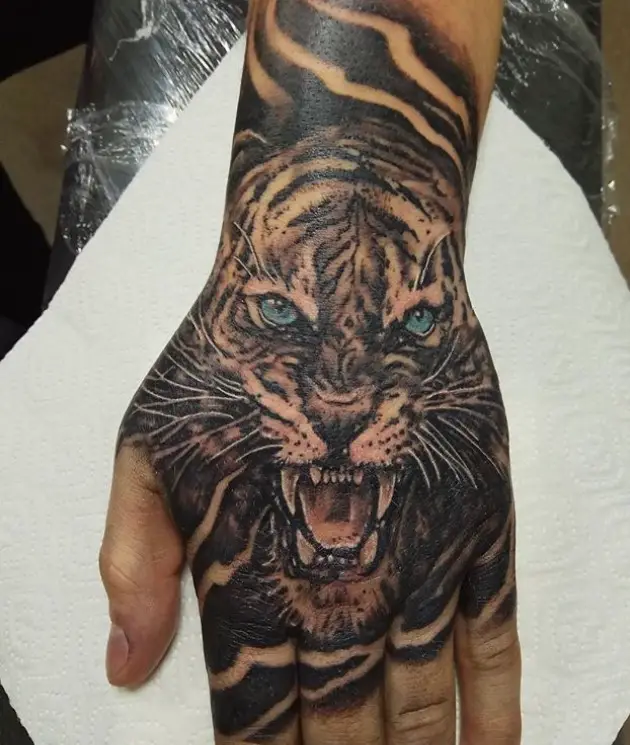 An angry Tiger Tattoo on the hand