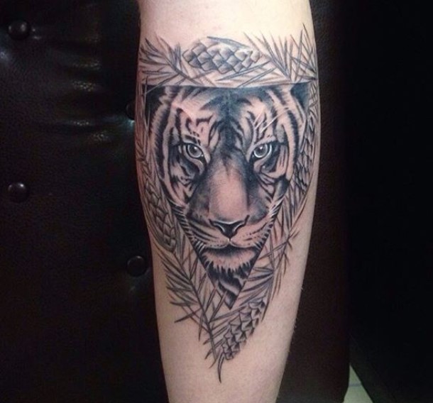 A Tiger Tattoo in a triangle tattoo on the forearm