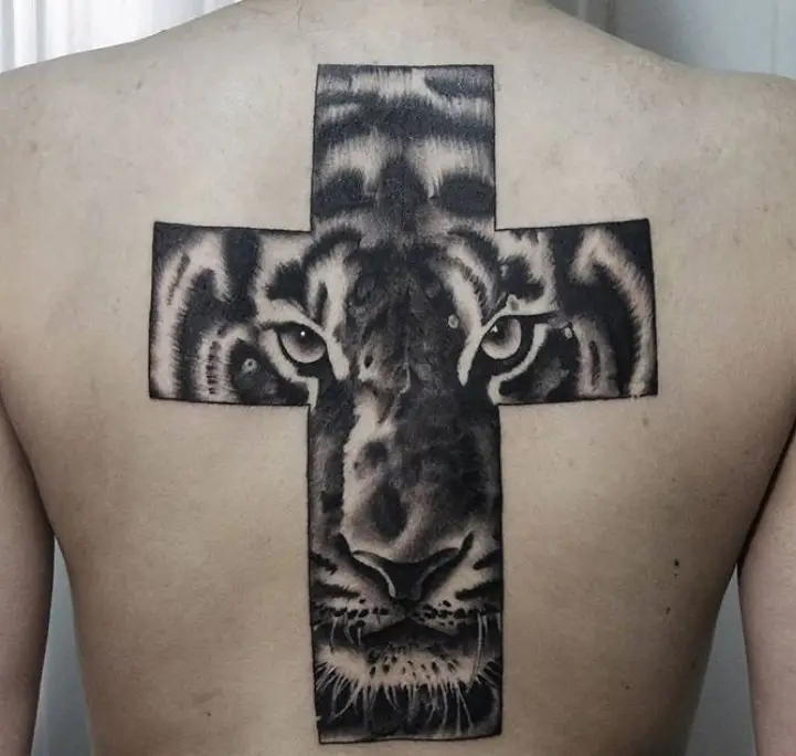 3D face of a Tiger Tattoo in a cross tattoo on the back of the woman