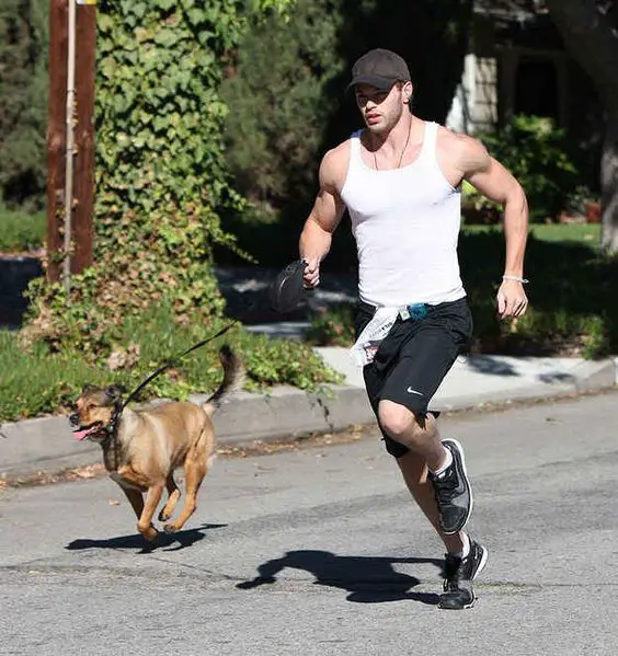 Kellan Lutz running with his dog