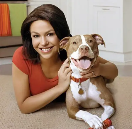 Rachael Ray lying on the floor with her smiling Pit Bull