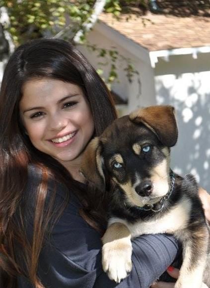 Selena Gomez holding her Siberian Husky mix in her arms