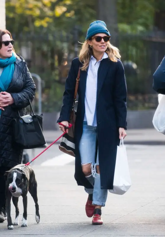Sienna Miller walking in the street with her dog