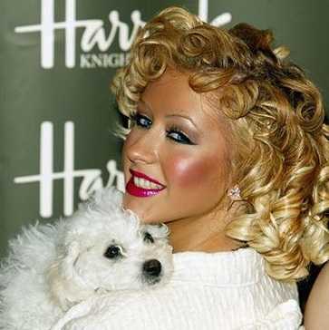 Christina Aguilera with her Bichon Frise on her shoulders