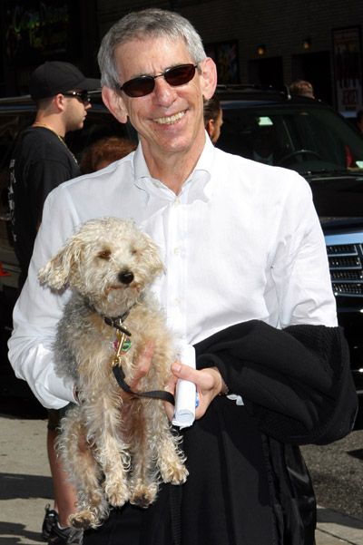 Richard Belzer carrying his Bicon Frise