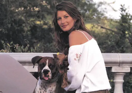 Giselle Bundchen in the balcony with her Boxer Dog 