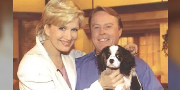 Diane Sawyer with and a guy holding a Cavalier King Charles Spaniel dog