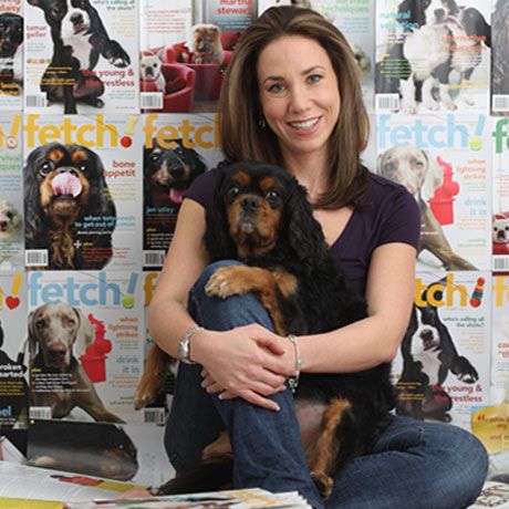 Natasha Ashton sitting with her Cavalier King Charles Spaniels dog in her lap