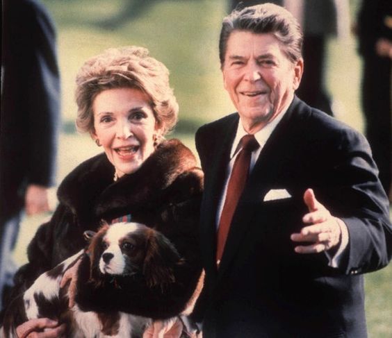 Ronald Reagan and Nancy Reagan with their cute Cavalier King Charles Spaniel dog