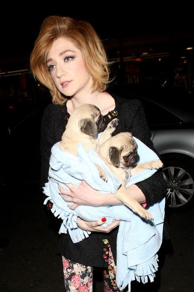 Nicola Roberts with here two pug in her arms