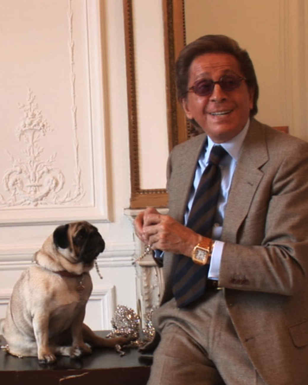 Valentino with his pug on the table