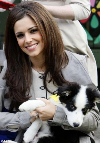 Cheryl Cole with her Border Collie puppy in her lap