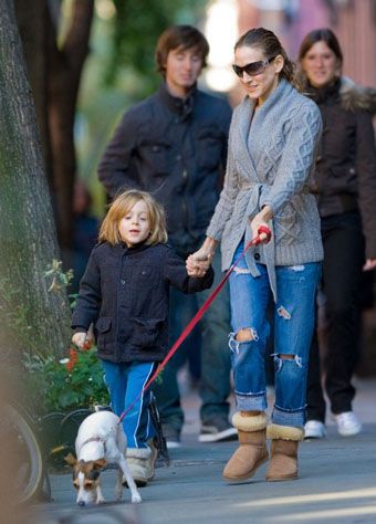  Sarah Jessica Parker walking in the street with her kid and her Jack Russell