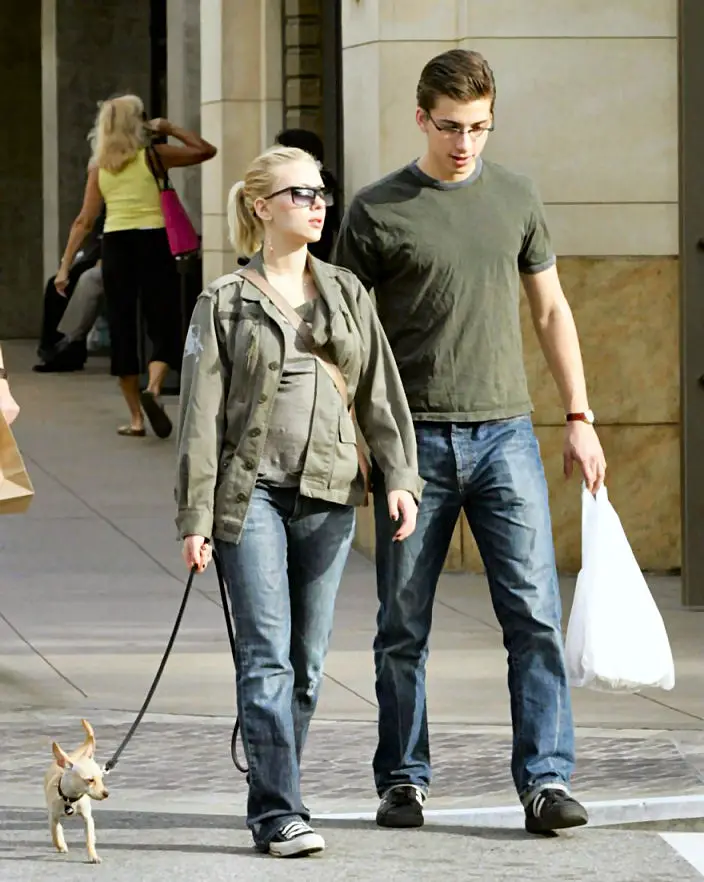 Scarlett Johansson walking in the street with her Chihuahua on a leash
