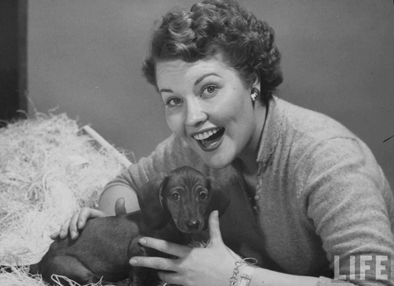 black and white photo of Patti Page with her dachshund dog