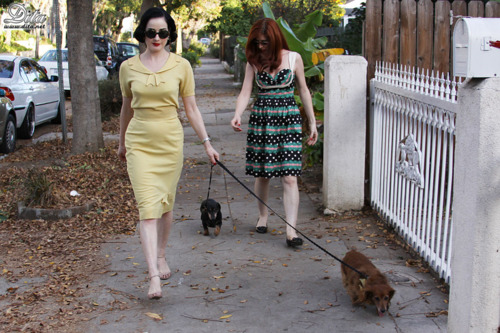 Dita von Teese walking her Dachshund in the street