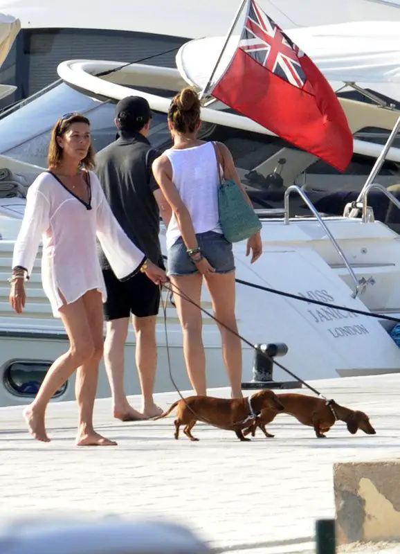 Princess Charlotte at the port walking with her two Dachshunds