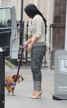 Nicole Scherzinger walking in the street with her English Bulldog