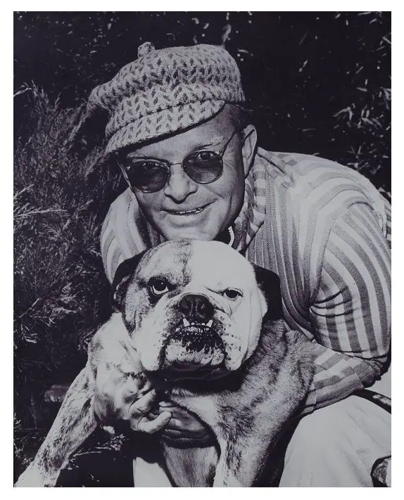 black and white photo of Truman Capote with his English Bulldog